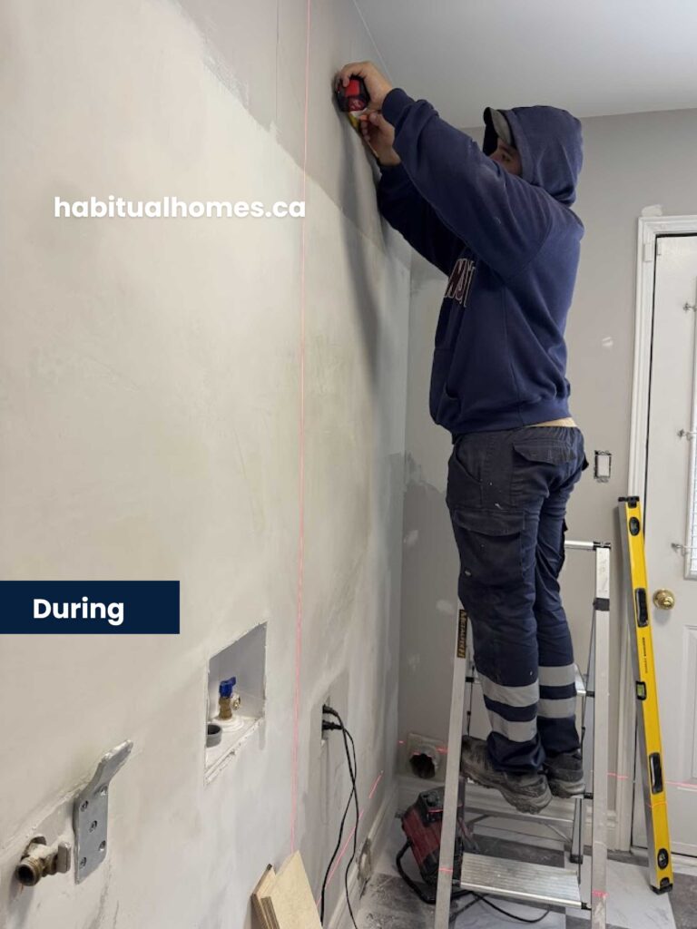 installing-cabinets-laundry-remodel.jpg