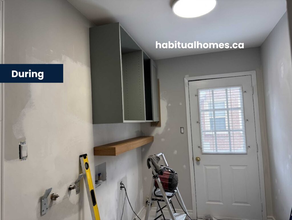installing-cabinets-laundry-remodel.jpg