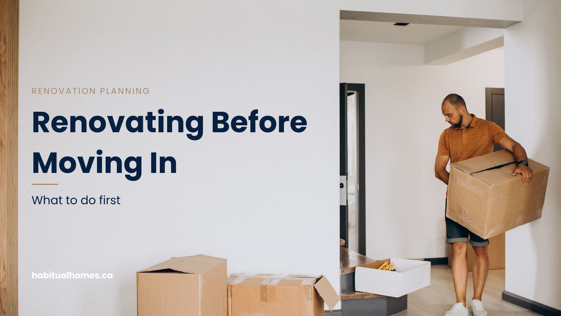 Man carrying a moving box into an empty, freshly renovated home before moving in