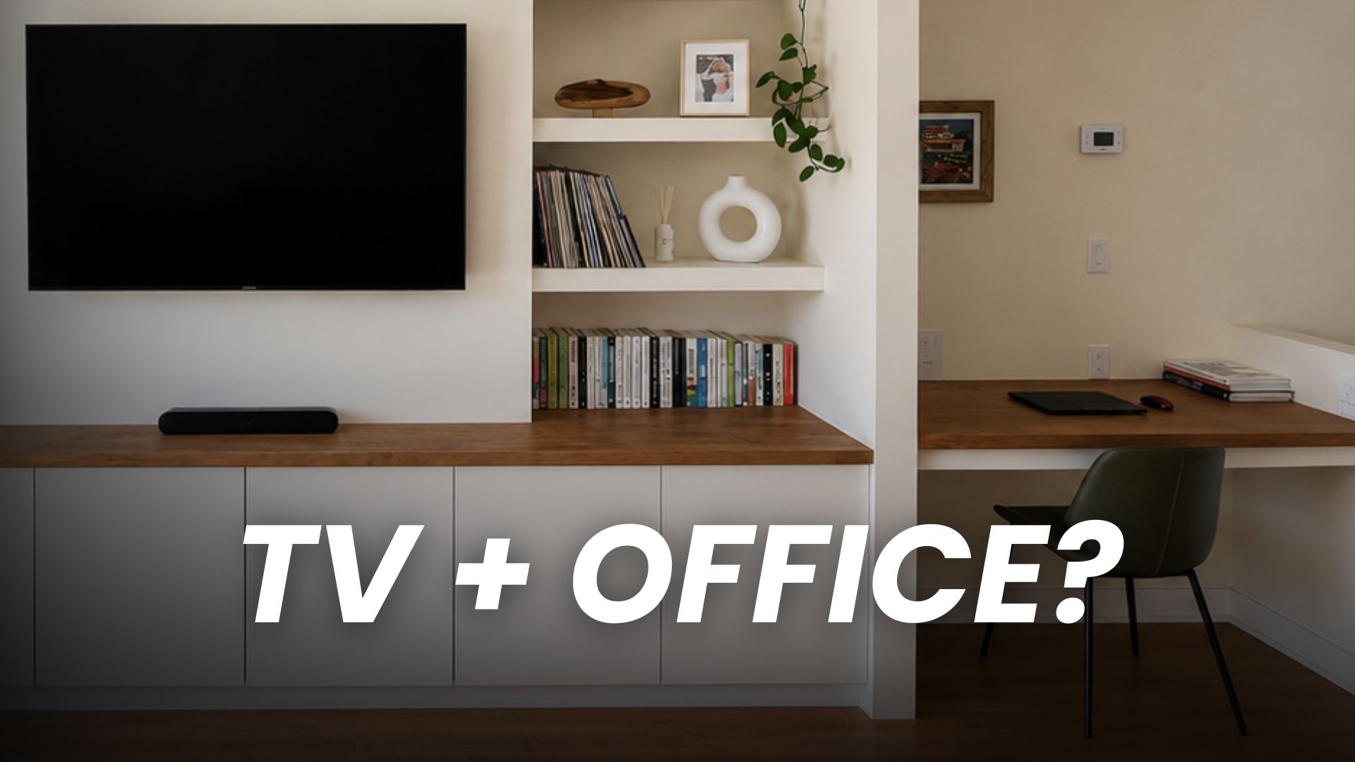 Home office in a TV wall with a built-in desk, shelving, and mounted TV in a Toronto living room